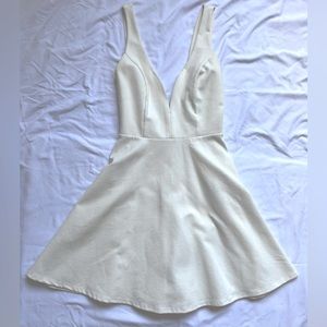 White skater dress with plunge neckline